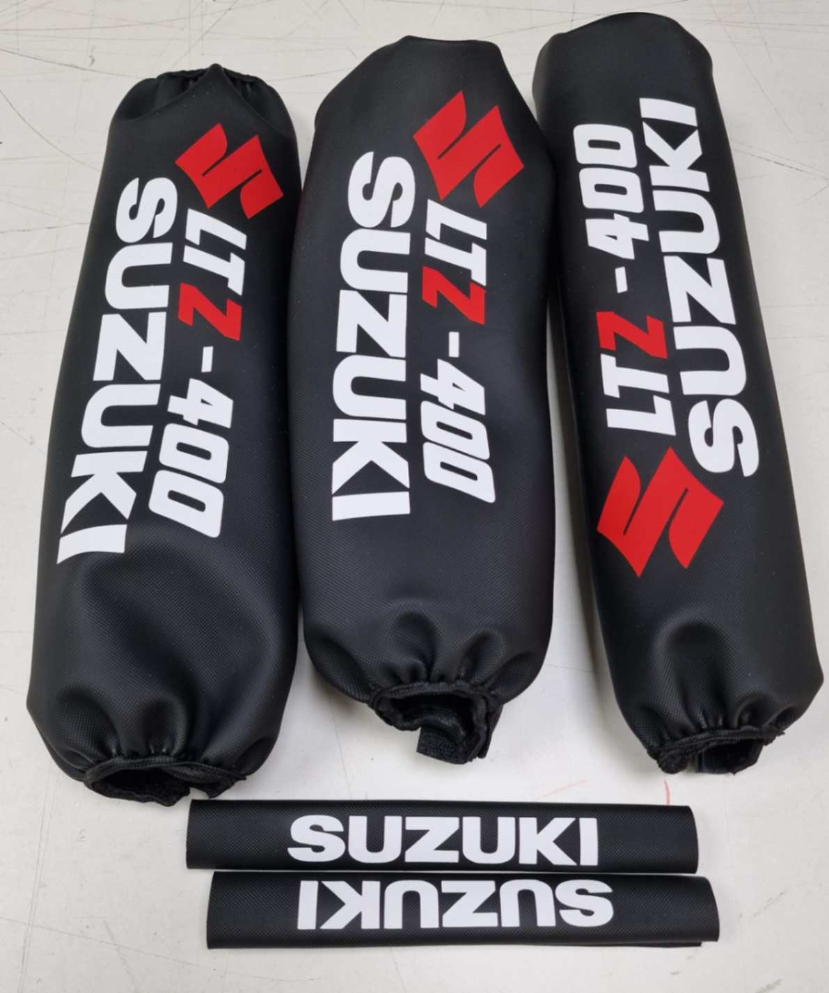 PROTECTORES DE AMORTIGUADORES SUZUKI LTZ400 blanco/negro/rojo